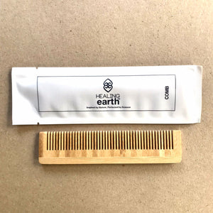 Healing Earth bamboo comb packaged in an easily recyclable 100% stone paper sachet.