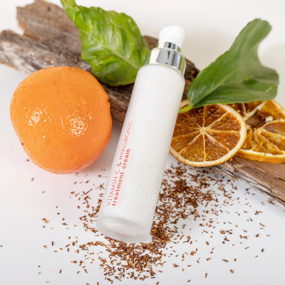Healing Earth Vitamin C and Hyaluronic Treatment Cream to brighten and hydrate skin. Presented in glass vial with pump dispensers. Sold by SR Amenities Hotel & Spa Suppliers.