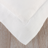 Duvet cover with satin stitch oxford trim. Manufactured from white, plain weave, pure flax linen woven in Cape Town from French linen fibre. Sold by SR Amenities Hotel and Spa Supplies. 