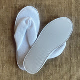 White washable and reusable thong style slipper made from terry towel fabric with textured water resistant sole. Shop at www.sramenities.co.za