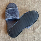 Grey fleece open toe slipper with EVA non-slip sole. 