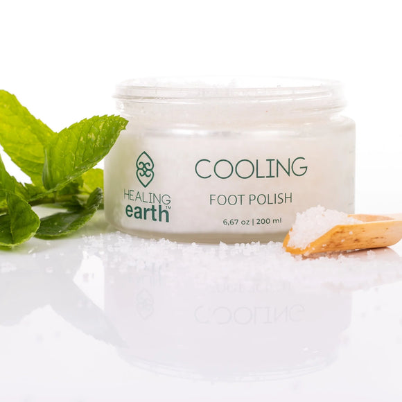 pinotage therapy cooling foot polish, 200ml, with a screw cap, a spoon of this amazing scrub next to it and mint leaves to accentuate the tub