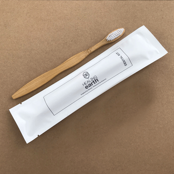 Eco-friendly Bamboo toothbrush in an eco-friendly 100% stone paper sachet.
