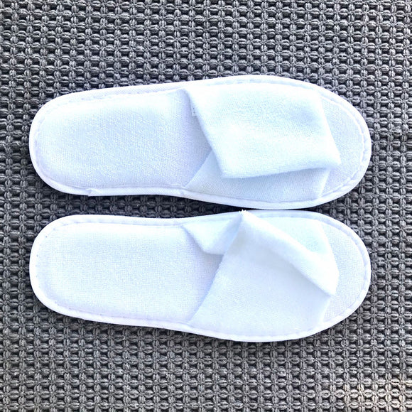 Single use disposable white terry towel open toe slipper. Shop at www.sramenities.co.za