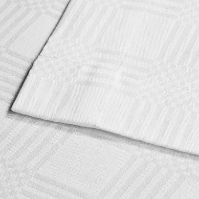 White serviette made from a white 50/50 poly-cotton dobby weave fabric with a classic block check pattern. Sold by SR Amenities Hotel and Spa Supplies.