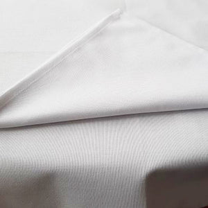 White poly-cotton Conlyn weave tablecloth and serviette with a  1 cm hem. Sold by SR Amenities Hotel and Spa Supplies.