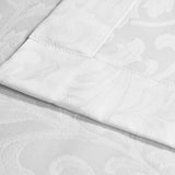 Jacquard damask white serviette made from poly-cotton fabric with woven palace pattern. Sold by SR Amenities Hotel and Spa Supplies.
